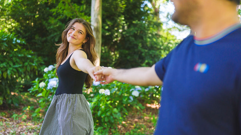Bride-to-be leading her fiancé through Shinjuku Gyoen during their engagement photo session