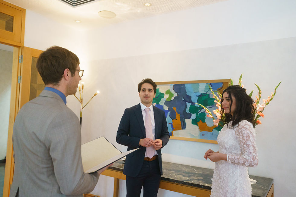 Swedish couple standing before an officiant during their intimate embassy wedding ceremony in Tokyo Japan