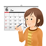 3552カレンダーの前で予定を確認する一般人女性.png
