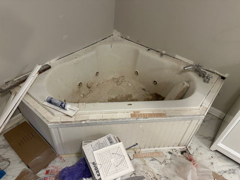 before photo of a jetted tub conversion, bathroom refinishing process