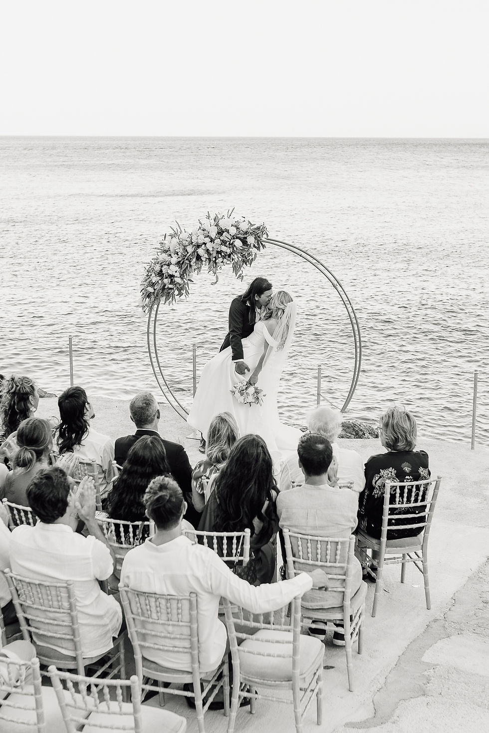 Wide angle view of a Greek island wedding venue overlooking the sea