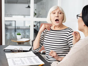 Adult working with a speech-language pathologist during a therapy session to improve communication skills.