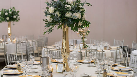 Wedding Centerpiece. Gold vase with Floral and greenery.