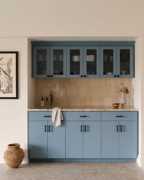 Soft blue wooden cabinets with modern accents and 