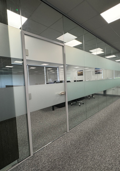 Office partitioning with frosted glass panels 