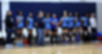 ICHS students girls volleyball standing for national anthem