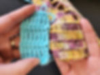 A light blue swatch of treble and single crochet stitches held alongside a similar fabric worked in a lighter weight yarn.