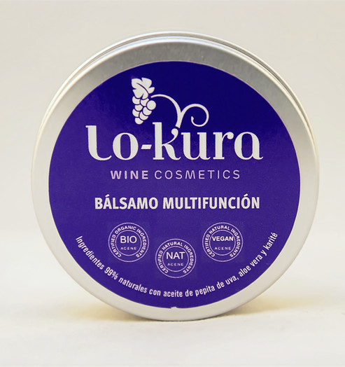Bálsamo multifunción lo-kura wine cosmetics, lata de aluminio con etiqueta morada. primer plano.