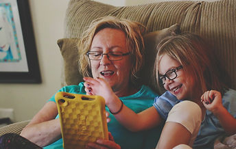woman-and-girl-using-tablet-computer-ret