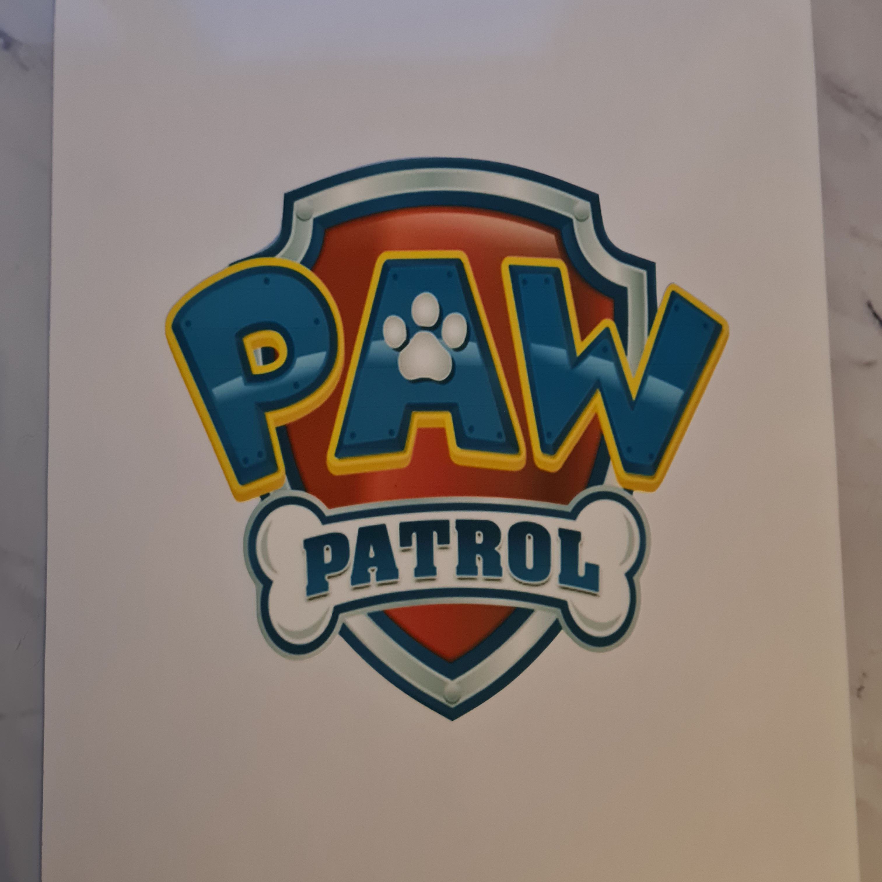 Paw patrol emblem cake topper icing or wafer