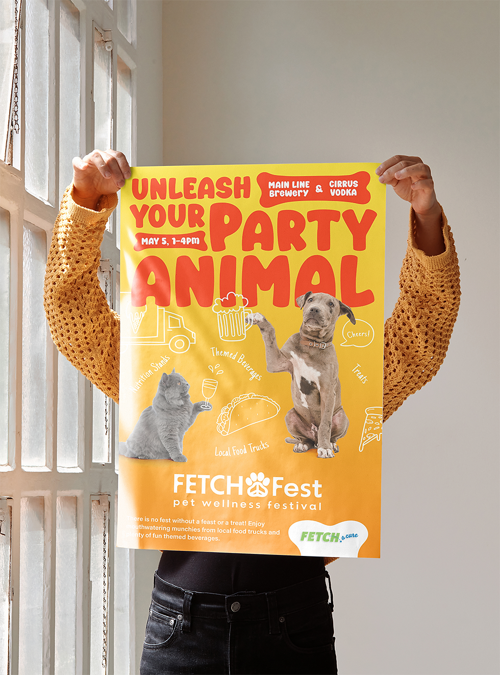 a women holding a yellow poster with a cat and a dog