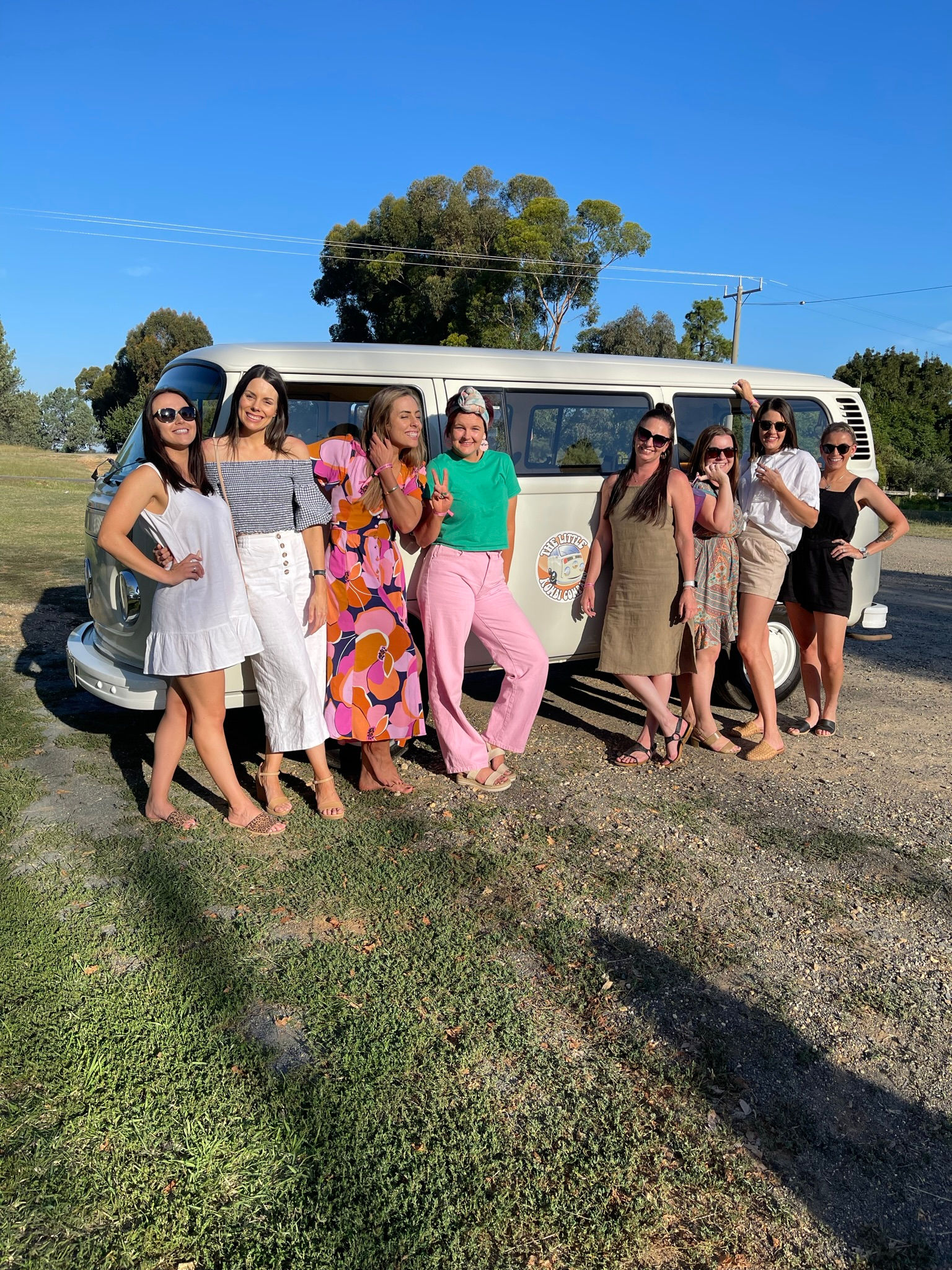 Wine tour ladies posing in front of a kombi on a sunny day
