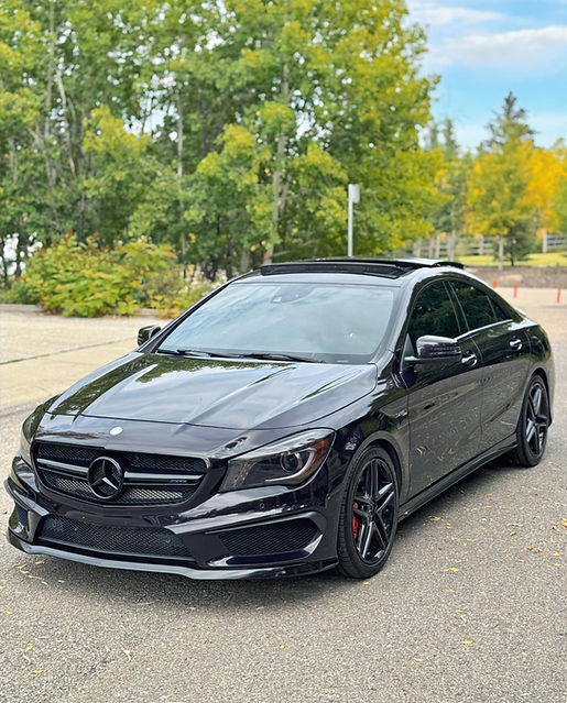 Hand washed vehicle showing high-gloss reflection from mobile detailing service.
