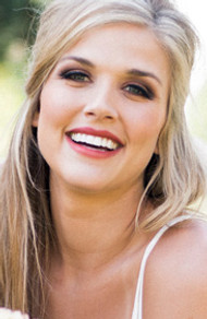 Smiling woman with beautiful light makeup