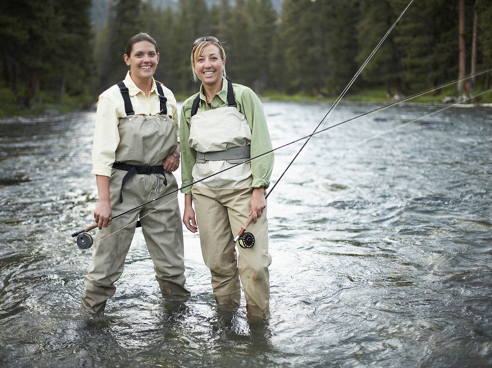 Two friends fly fishing as a hobby