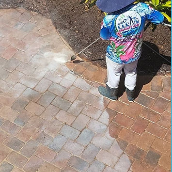 Pavers with failing sealer before strip and reseal in St. Lucie County