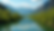 Eye-level view of vivid green mountains reflecting in the Gila River