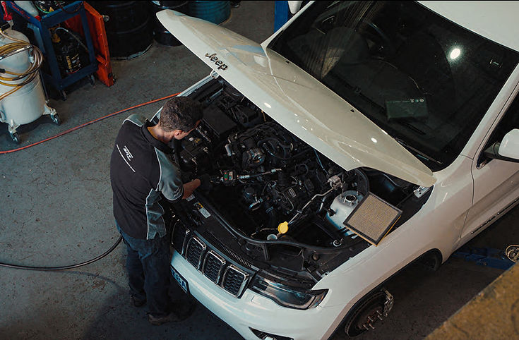 SRT technician servicing Jeep Grand Cherokee in Canberra workshop