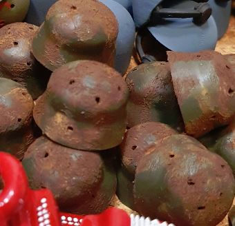 Miniature : Rusty German Stahlhelm with bullet holes