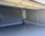 Finished garage with grey walls and full-flake concrete floor coating by Alpha Crest in East Tennessee