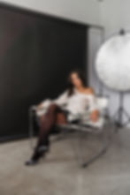 OWNER OF LMT Design, sitting in a design studio.