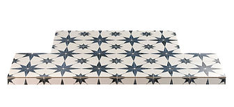 Black and white patterned tiles for a durable stove hearth