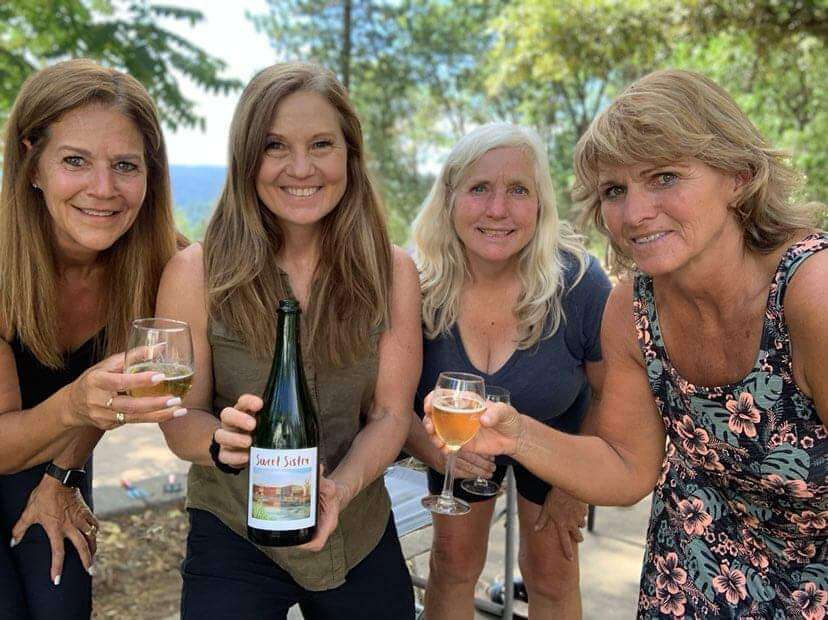 mid life women enjoying wine