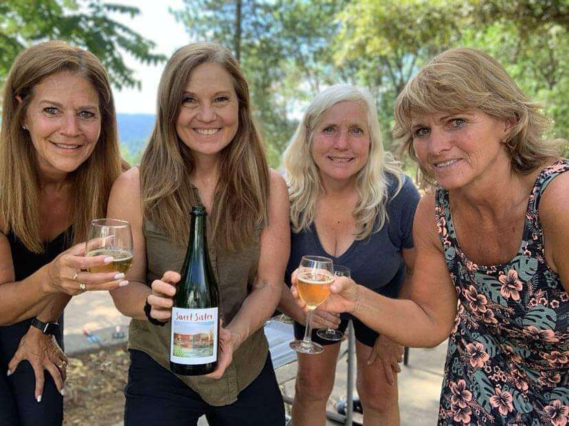 mid life women enjoying wine