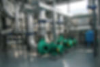 Group of powerful pumps in modern boiler-house.jpg