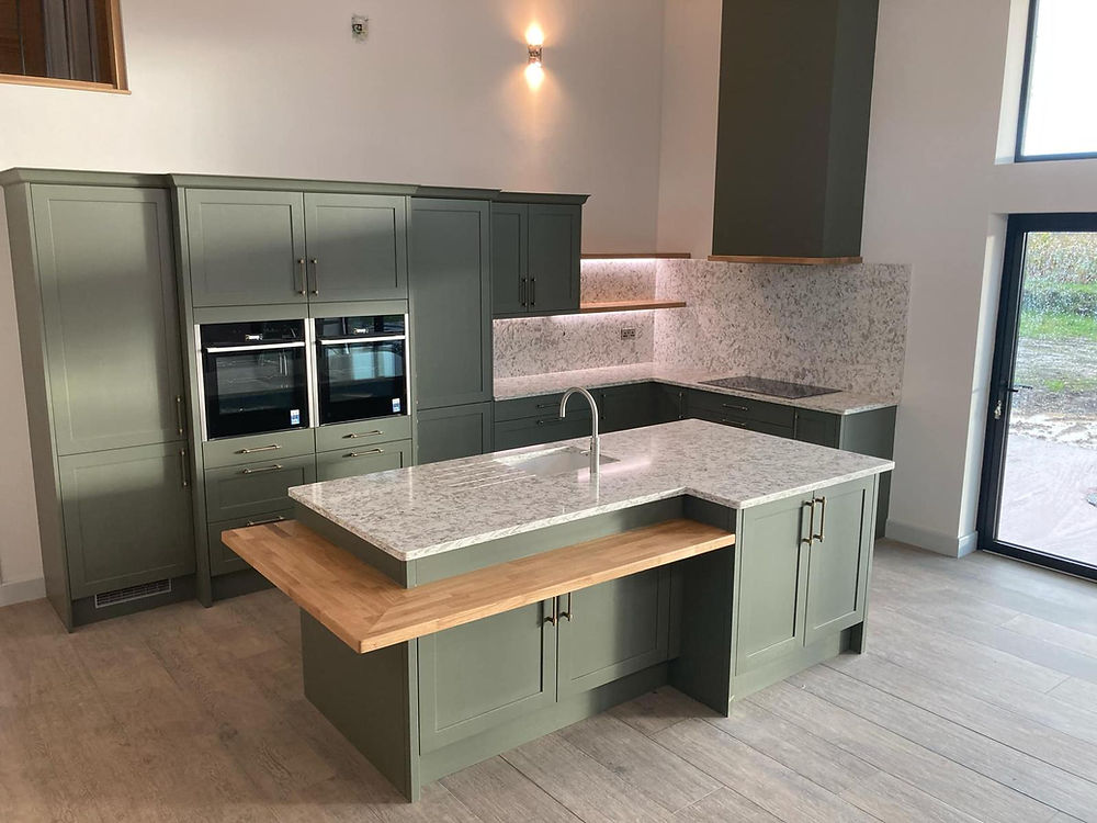 Modern kitchen island for kitchens in Honiton with integrated ovens