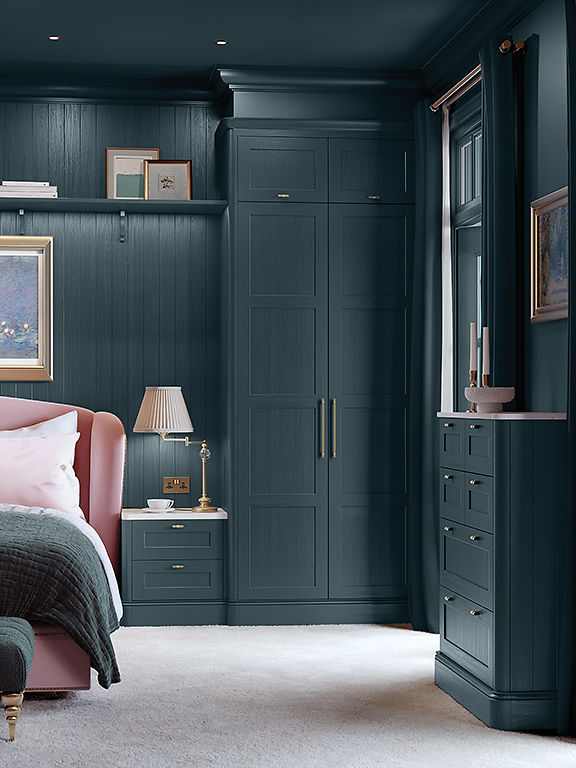 Dark teal fitted wardrobes by a professional bedroom designer