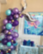Balloon mermaid tail made of many small balloons. Colors: purple shades, gold, blue and clear