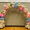 Thumbnail: Big organic balloon arch. Colors: beige, blue, pink and colorful balloon flowers