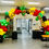 Thumbnail: Big organic balloon arch. Colors: black, yellow, red, green with stars in and balloon letters "black history month"
