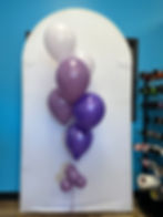 Thumbnail: A latex balloon bundle. Purple shades and white colors