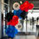 Thumbnail: Balloom garland. Colors: blue, red, black. Two big white balloons with logos printed on them