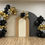 Thumbnail: Balloom garland. Colors: black, golden and silver mylar start with a backdrop