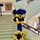 Thumbnail: A balloon pillar. Blue, yellow, white and golden balloons with balloon stars. Big balloon on top saying kent state homecoming