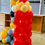 Thumbnail: Red balloon pillar with beige balloons on top