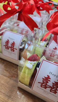 CORALS Catering assorted Swiss roll slices in a premium Chinese wedding door gift box with personalised packaging, ideal for wedding favours, receptions, and special events in Malaysia.