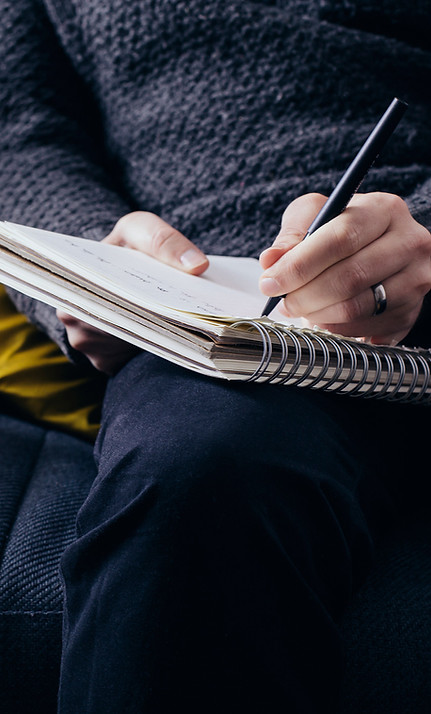 Woman-writing-warm-thoughtful-notepad sfw_edited.jpg