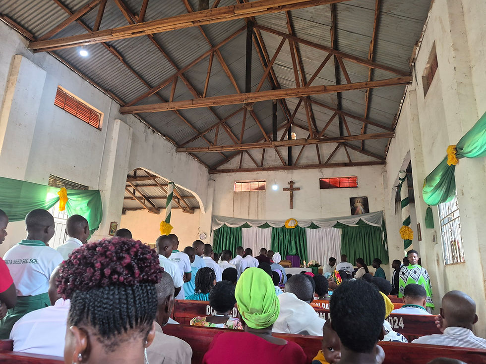 I've started attending Catholic Mass every week and I went on Ash Wednesday this week, which is where I took this photo. The nearby Catholic school students came to this mass as well to recieve communion, so you can see them lined up in the center in their uniforms.