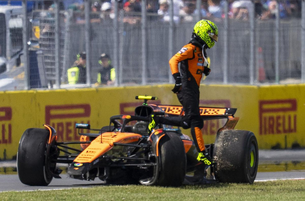 Norris jumping out of his McLaren after crashing out of the Canadian Grand Prix (Photo by: AP)