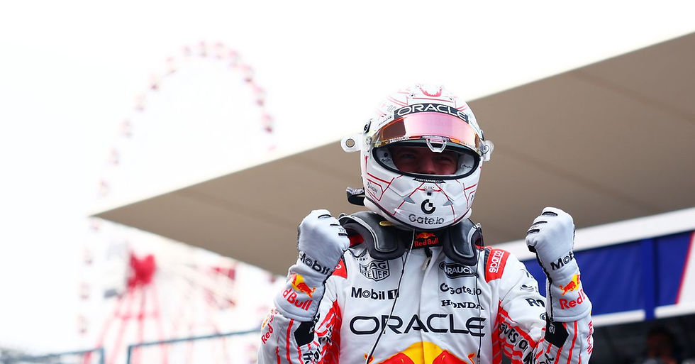 Max Verstappen celebrating his 4th consecutive win at the Japanese Grand Prix (Photo by Bryn Lennon/Getty Images)