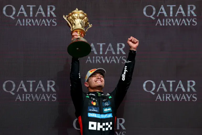 Lando Norris Celebrates home victory at the British Grand Prix (Photo by: Clive Rose/Getty Images)