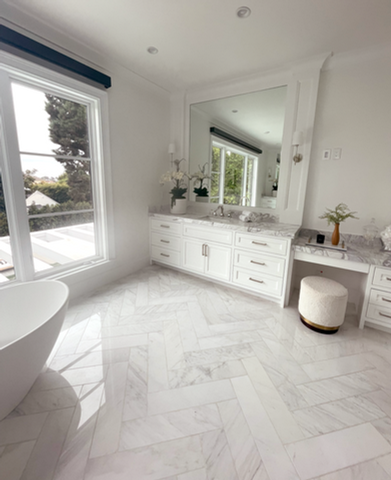 white bathroom free standing tub herringbone marble floors