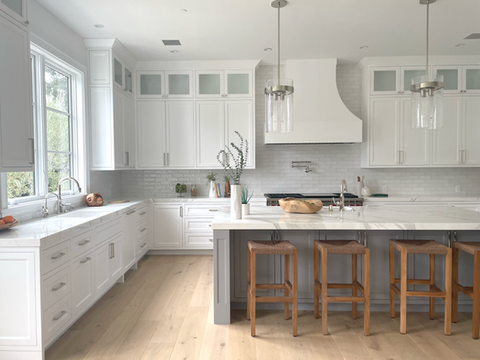 gray modern kitchen with white tile backsplash and kitchen island