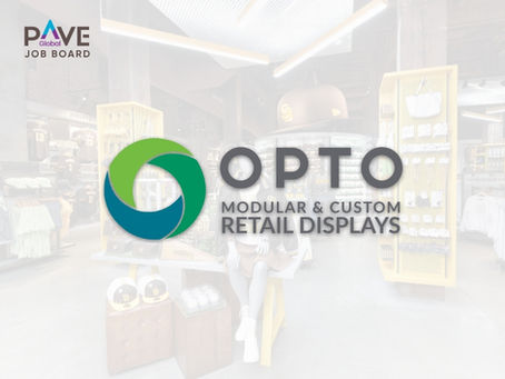 OPTO company logo featuring a circular design with green and teal interlocking elements, accompanied by the text 'OPTO MODULAR & CUSTOM RETAIL DISPLAYS'. The logo appears over a blurred background showing a modern retail store interior with bright lighting, white shelving displays, and various retail fixtures and signage. The PAVE Global Job Board logo is visible in the upper left corner.