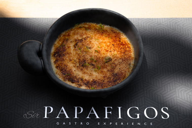 Gourmet plated dish in a dark bowl with refined presentation for Sir Papafigos restaurant branding in Heraklion