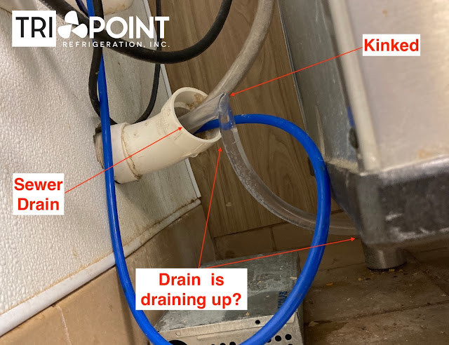 improperly installed commercial ice machine with kink in plastic tubing